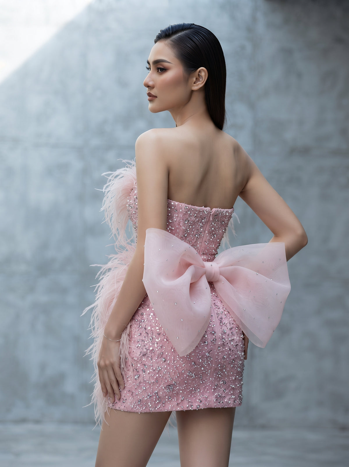 Bijou pink sequin feather bow mini dress by Fiore's Bridal - Back View