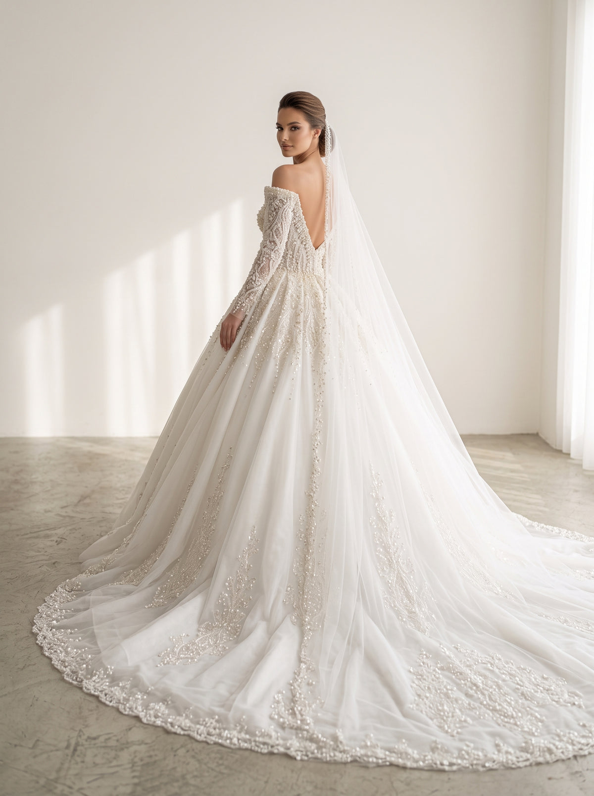 Lucia princess A-line wedding dress back view featuring pearl buttons and cathedral train by Fiore's Bridal - Back View