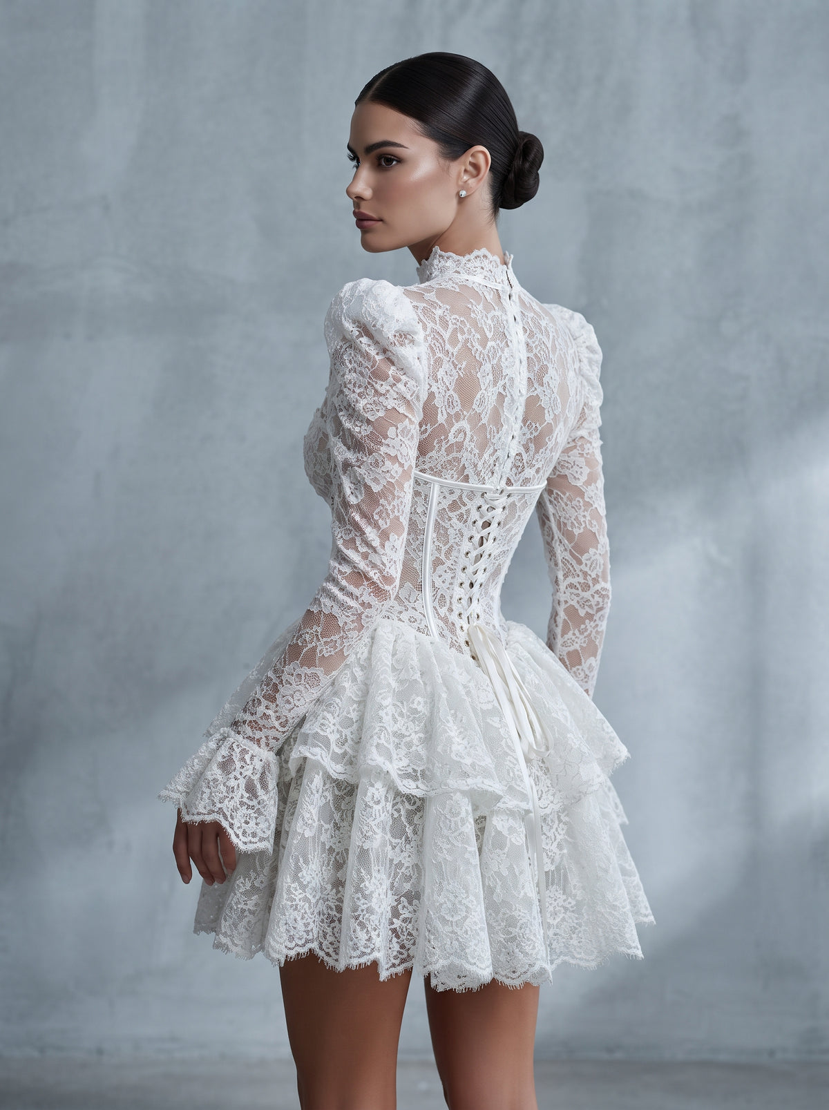 Noelle ivory lace long sleeve corset ruffle mini dress by Fiore's Bridal - Back View