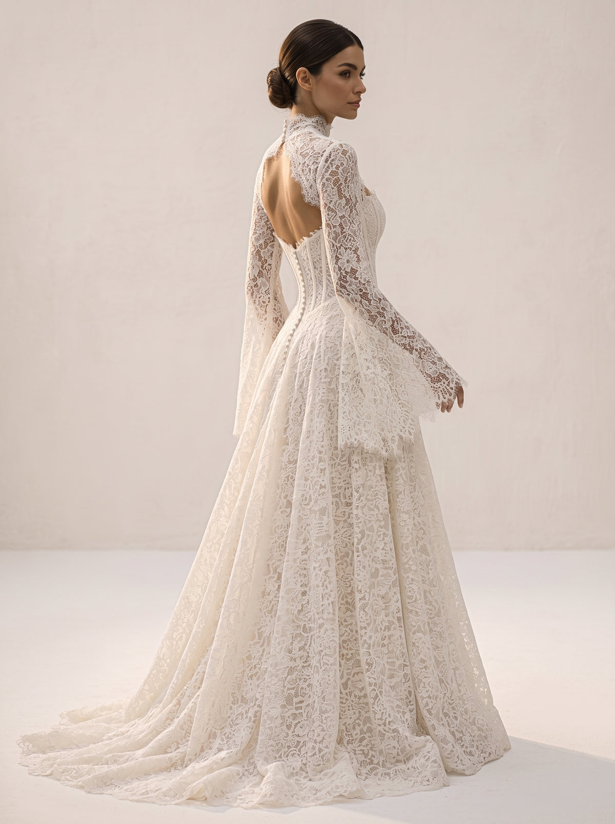 Phaedra Helen wedding dress back view featuring fluid chapel train by Fiore's Bridal - Back View