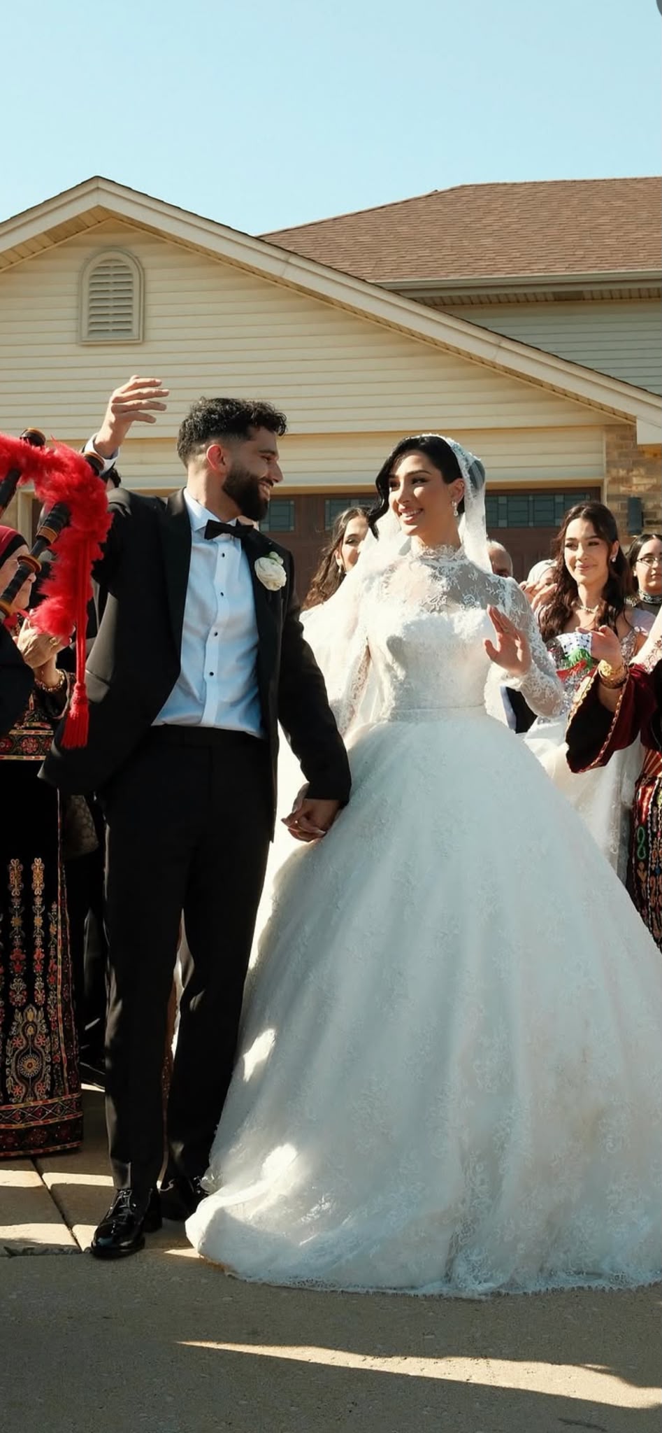 Halaa on her wedding day in a high-neck long-sleeve lace Fiore's Bridal ball gown