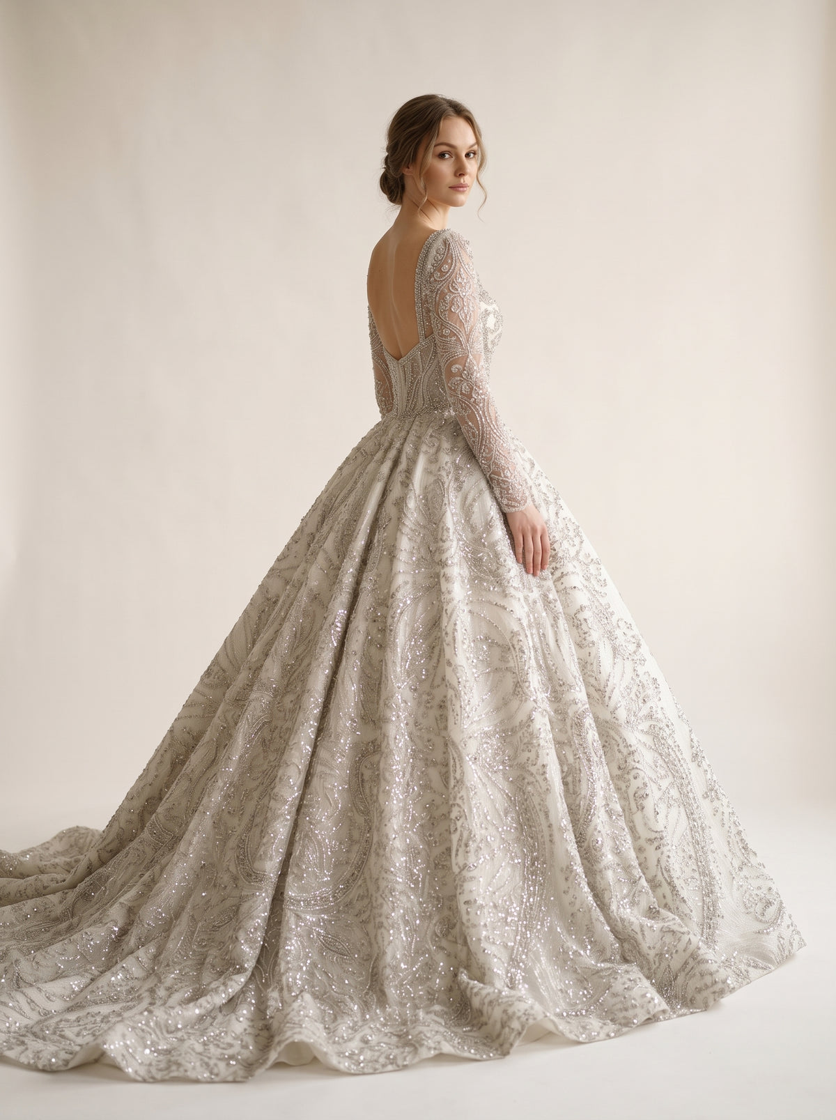 Aurelia ball gown wedding dress back view featuring cathedral train by Fiore's Bridal - Back View