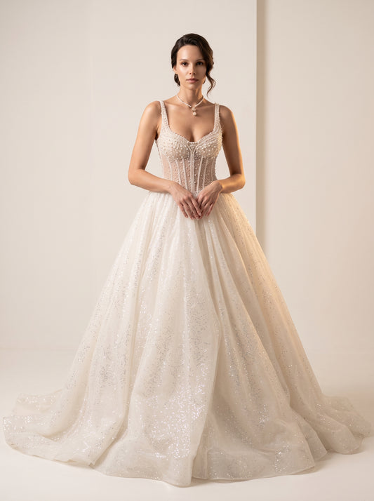Aurelia Pearl beaded glitter tulle beach A-line wedding dress by Fiore's Bridal - Front View