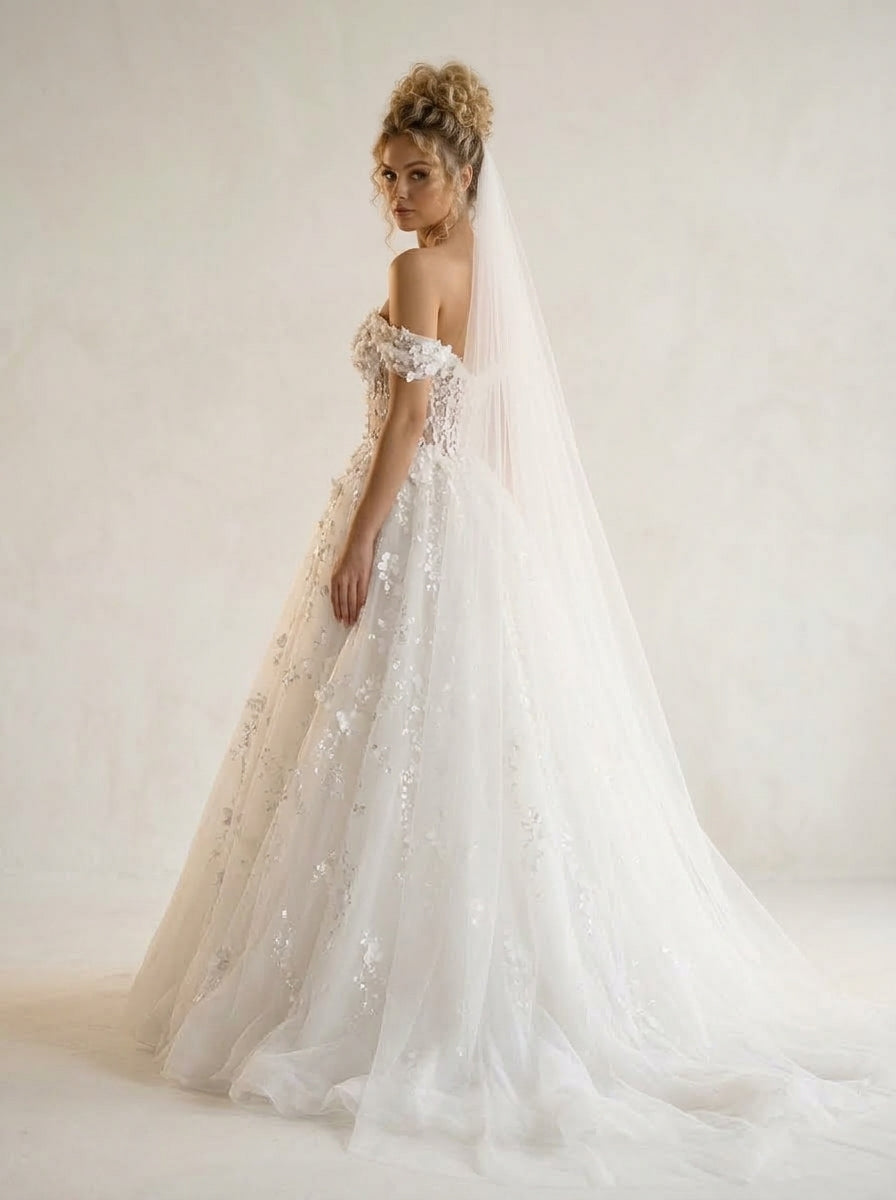 Calista Helen wedding dress back view featuring fluid chapel train by Fiore's Bridal - Back View