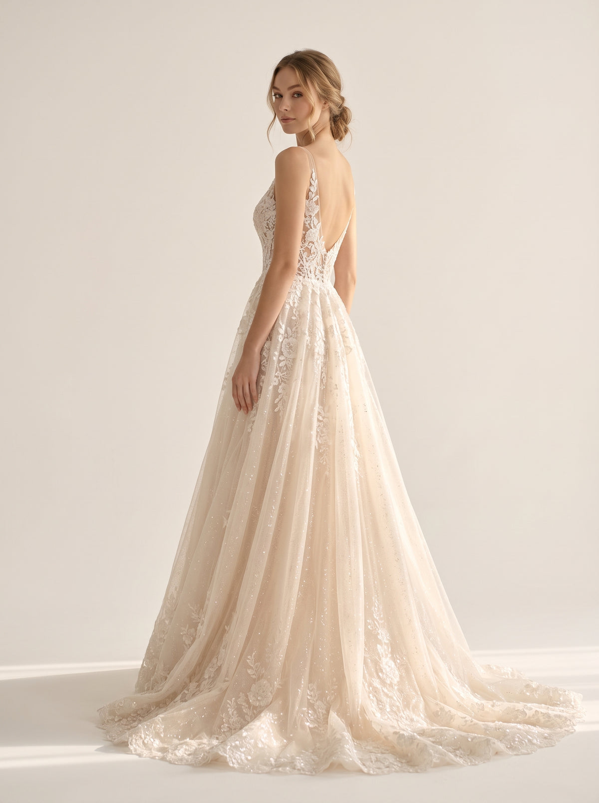 Fiorella Helen wedding dress back view featuring fluid chapel train by Fiore's Bridal - Back View