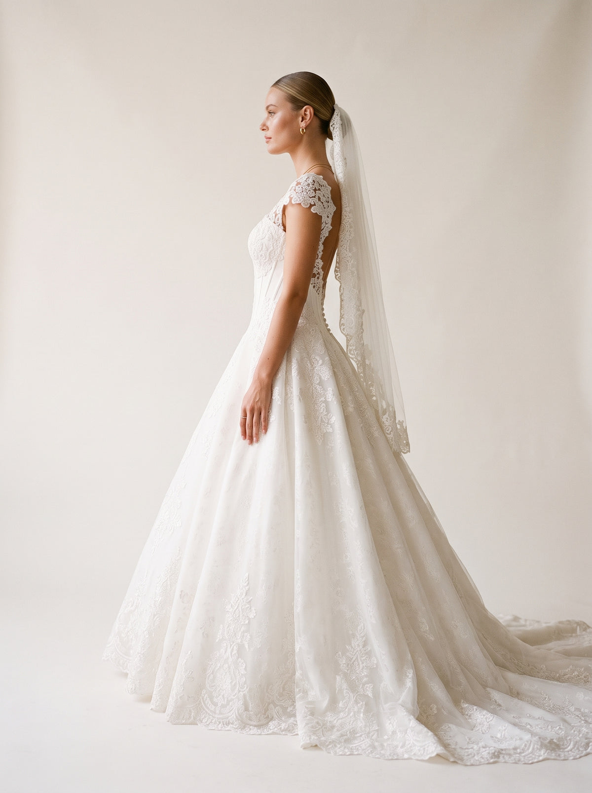 Flavia organza A-line wedding dress back view with buttons and chapel train by Fiore's Bridal - Back View